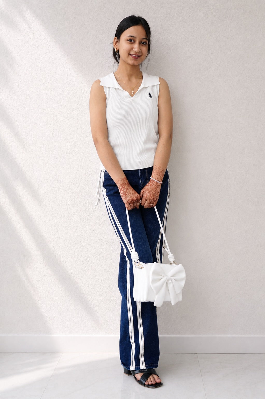 White Sleeveless Top with Blue Striped Jeans – Casual Chic Wear